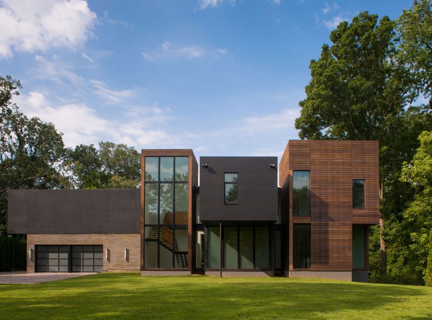 A Bright Contemporary Waterfront Home Overlaps Stone and Glass Volumes in Cabin John by Robert M. Gurney Architect (1)