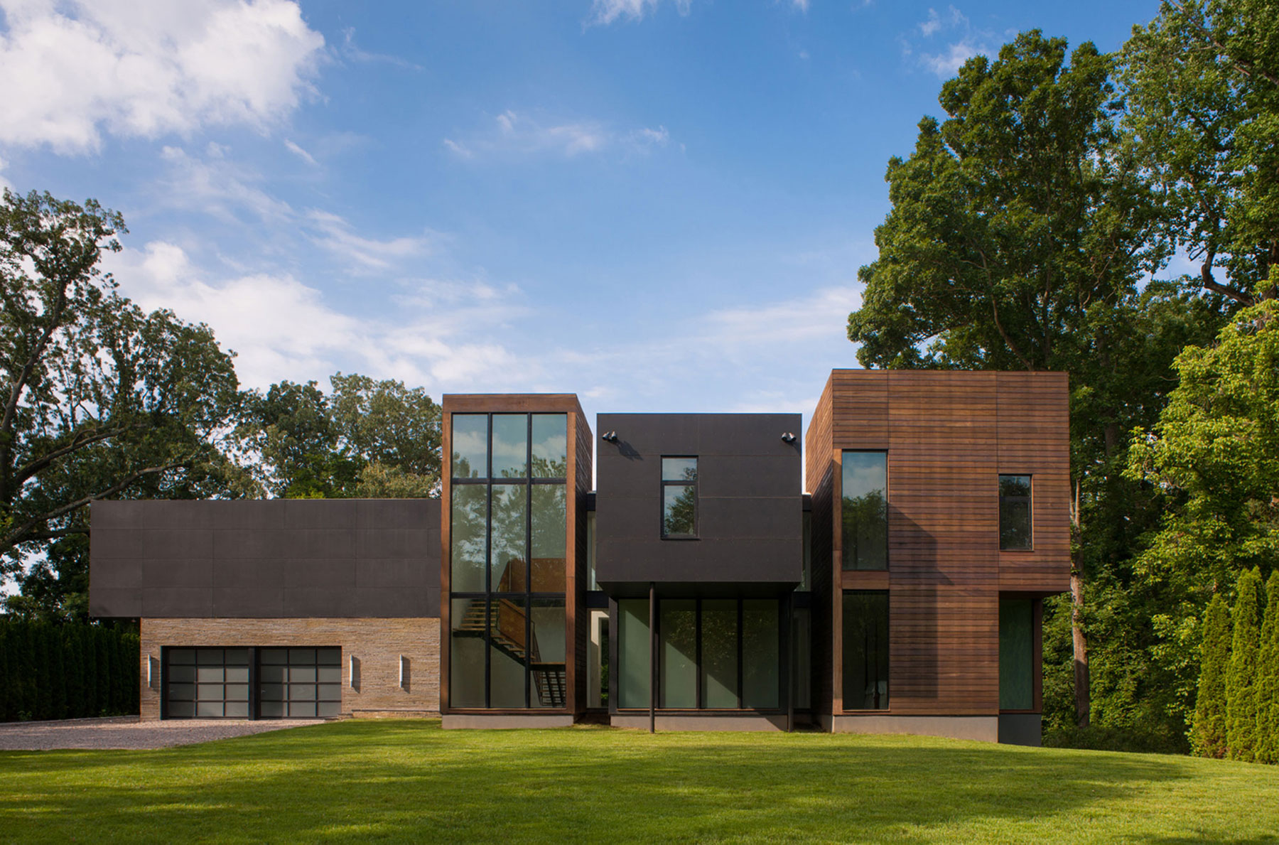 A Bright Contemporary Waterfront Home Overlaps Stone and Glass Volumes in Cabin John by Robert M. Gurney Architect (1)
