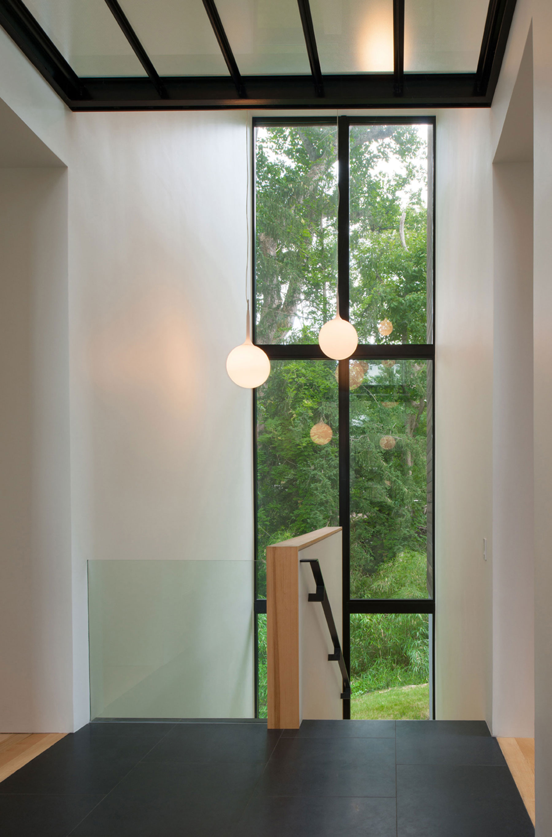 A Bright Contemporary Waterfront Home Overlaps Stone and Glass Volumes in Cabin John by Robert M. Gurney Architect (10)