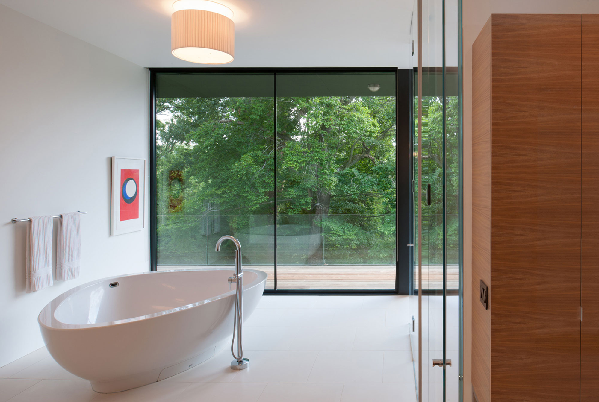 A Bright Contemporary Waterfront Home Overlaps Stone and Glass Volumes in Cabin John by Robert M. Gurney Architect (17)
