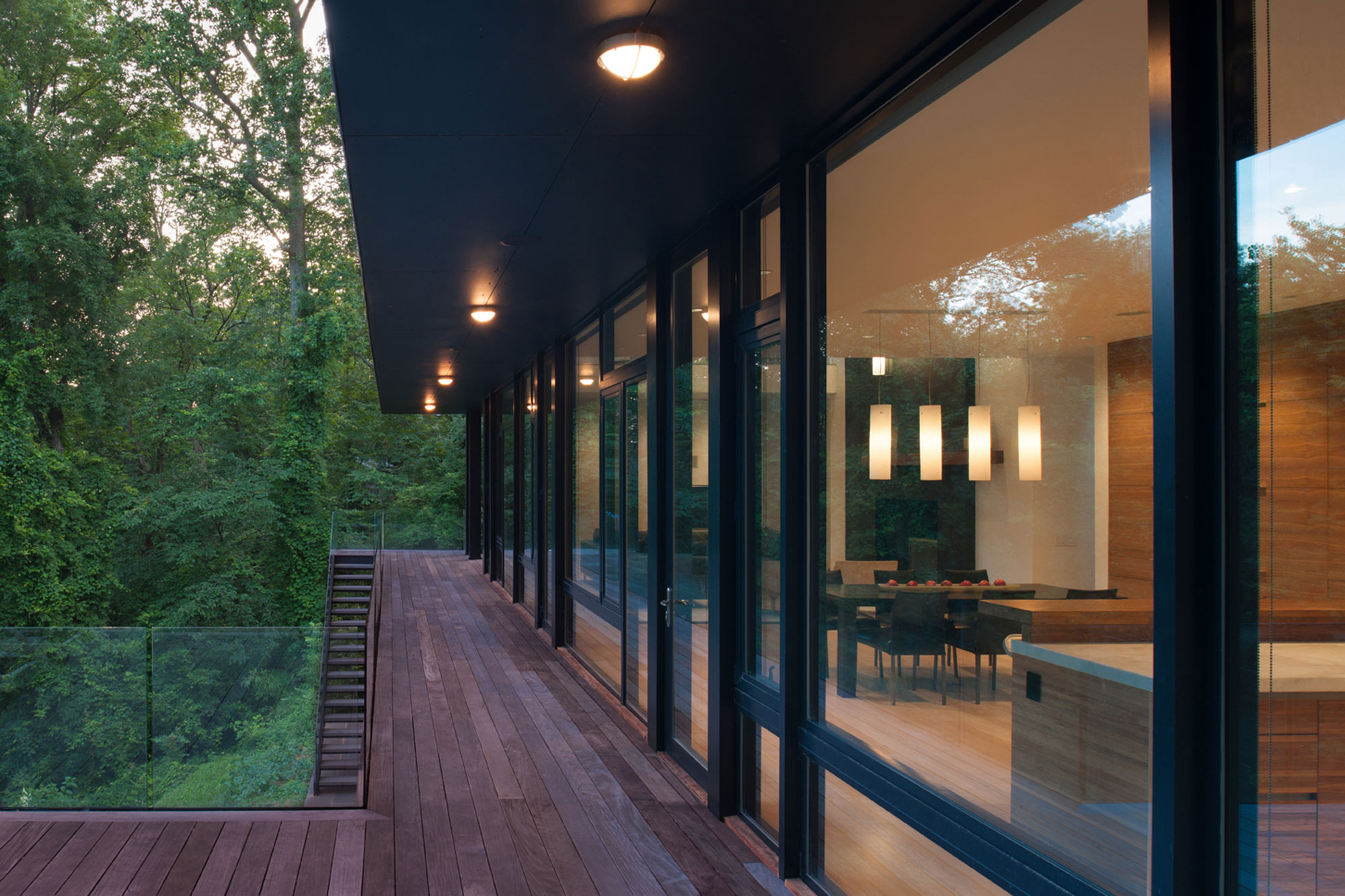 A Bright Contemporary Waterfront Home Overlaps Stone and Glass Volumes in Cabin John by Robert M. Gurney Architect (18)