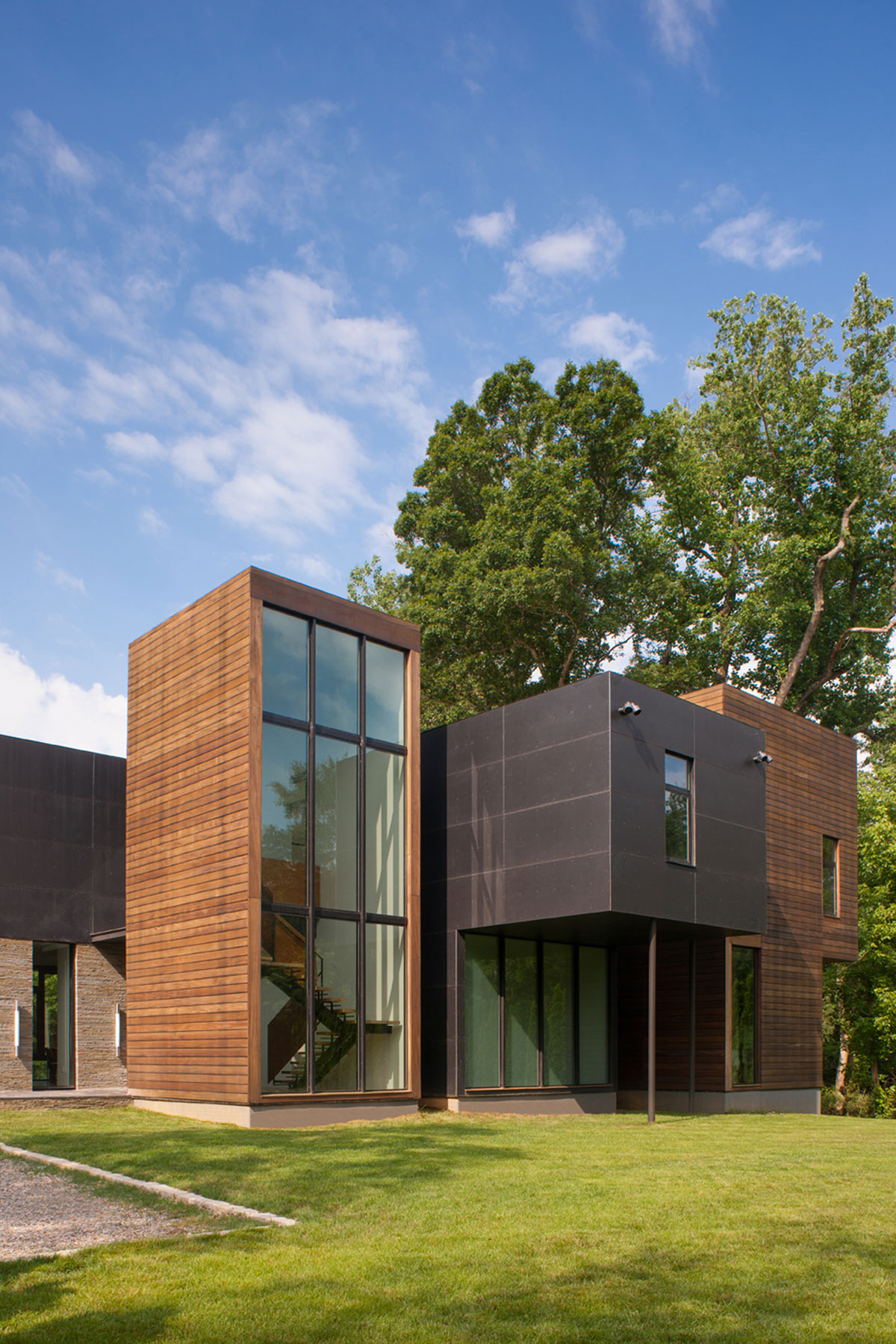 A Bright Contemporary Waterfront Home Overlaps Stone and Glass Volumes in Cabin John by Robert M. Gurney Architect (2)