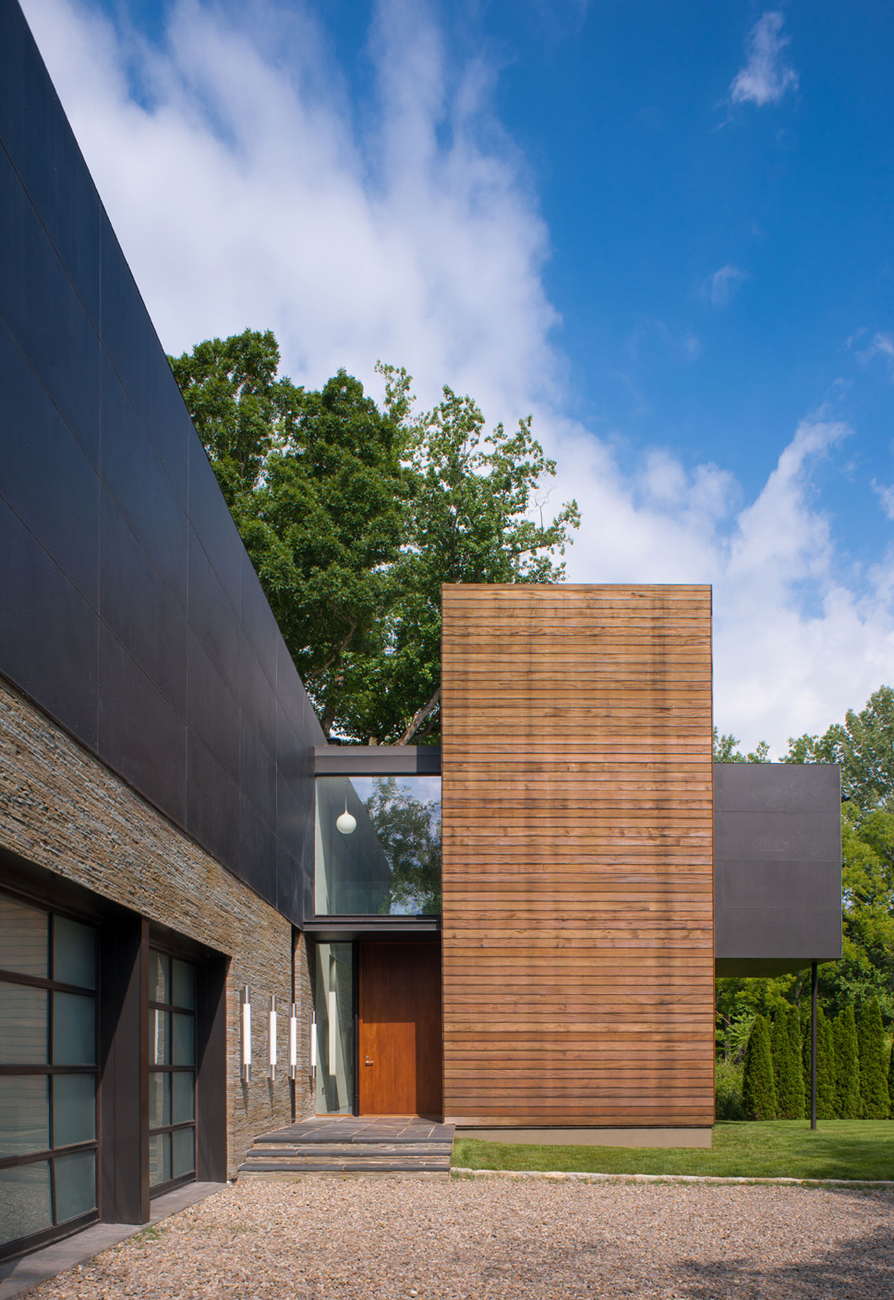 A Bright Contemporary Waterfront Home Overlaps Stone and Glass Volumes in Cabin John by Robert M. Gurney Architect (3)