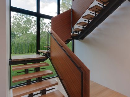 A Bright Contemporary Waterfront Home Overlaps Stone and Glass Volumes in Cabin John by Robert M. Gurney Architect (9)