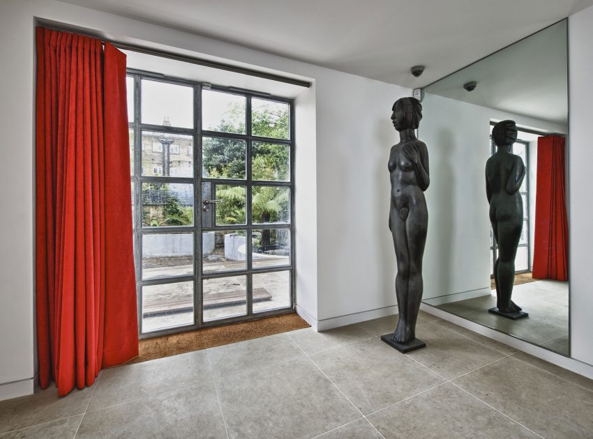 A Bright and Sleek Contemporary Home with Bold Interior Accents in London by Mimodo Architects (10)
