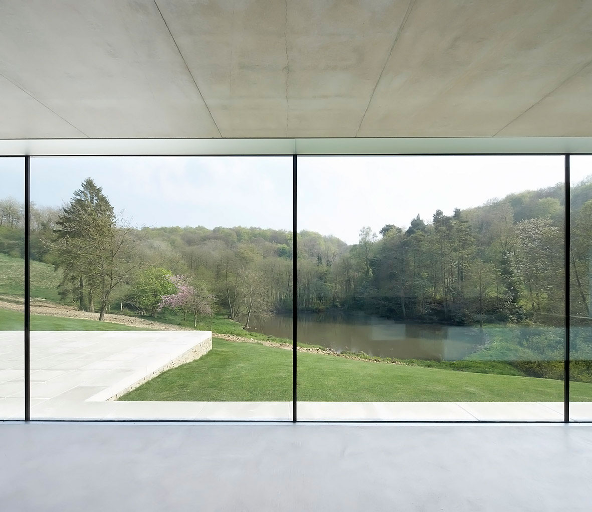 A Contemporary Vacation Home Surrounded by Perfect Landscaping and Green Rolling Grass in Cotswolds, England by Found Associates (17)