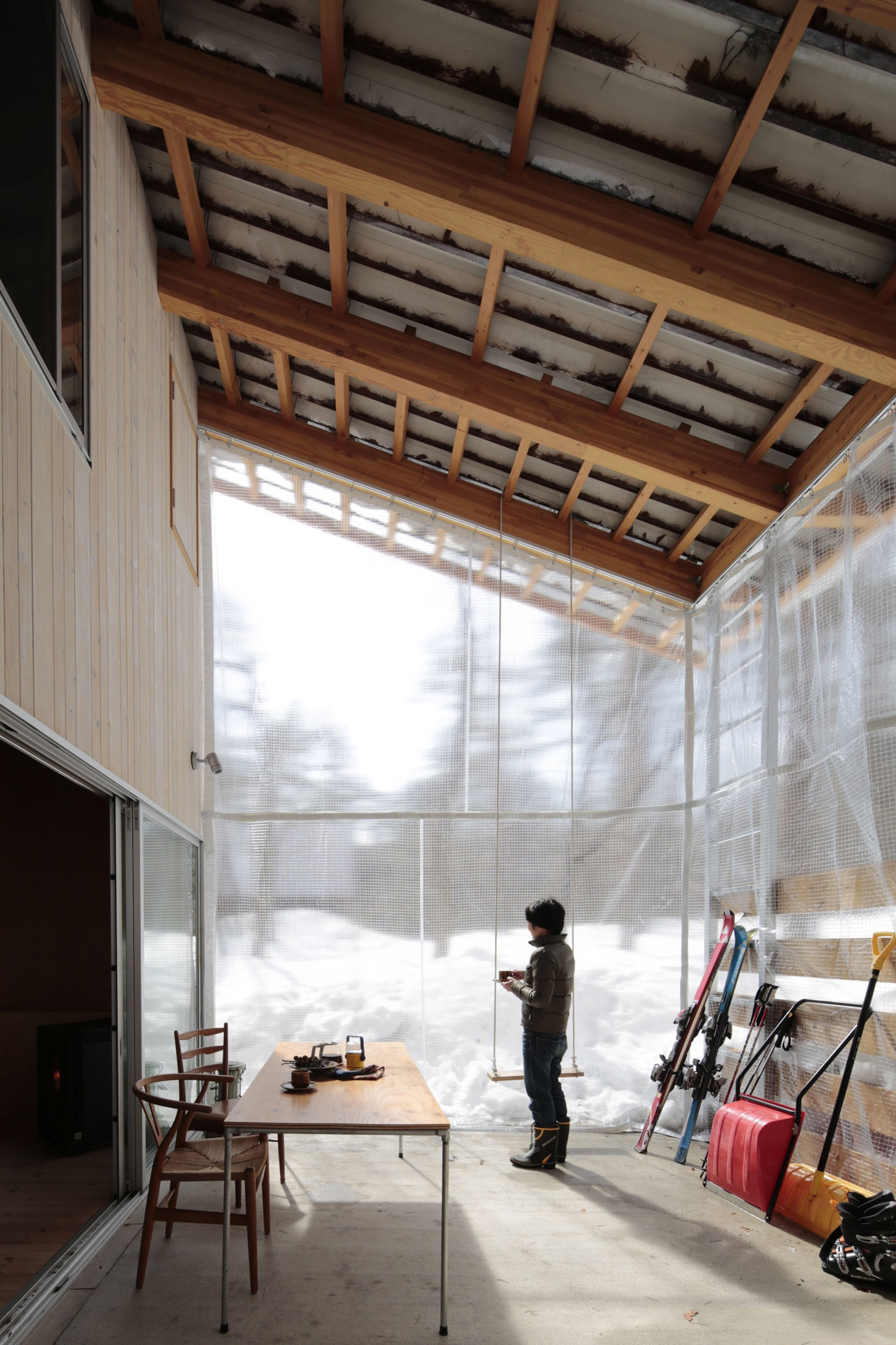 A Dramatic Contemporary Home with an Asymmetric Roof and Overhanging Eaves in Hakuba, Japan by Naka Architects (4)