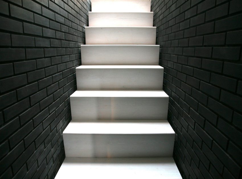 A Fascinating Home with Black Engineering Bricks and Slabs of White Marble in London by Liddicoat & Goldhill (12)