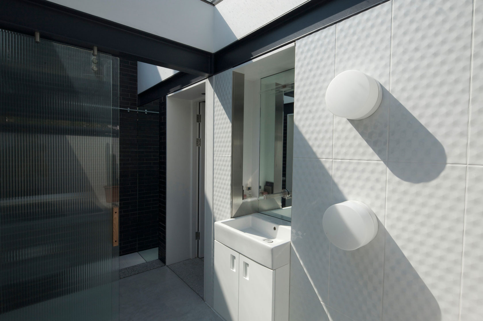 A Fascinating Home with Black Engineering Bricks and Slabs of White Marble in London by Liddicoat & Goldhill (14)