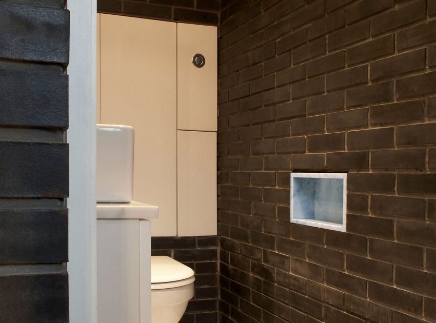 A Fascinating Home with Black Engineering Bricks and Slabs of White Marble in London by Liddicoat & Goldhill (18)