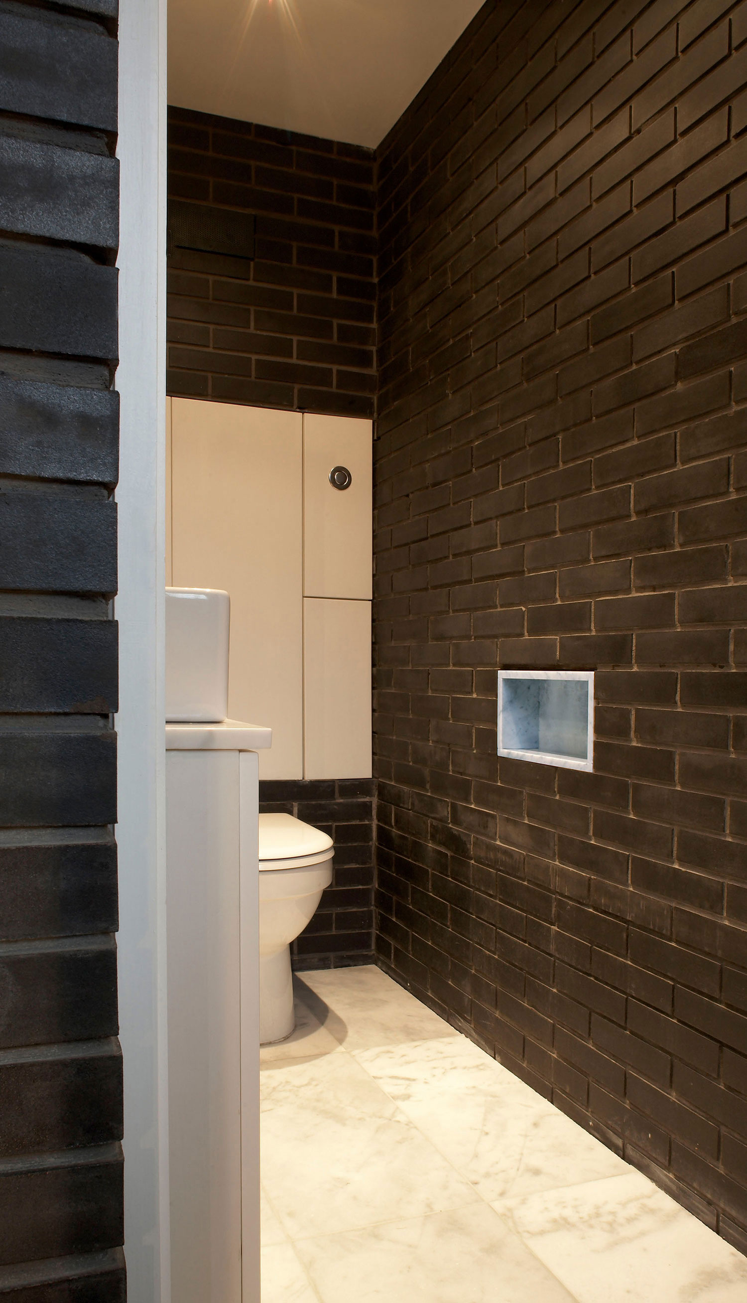 A Fascinating Home with Black Engineering Bricks and Slabs of White Marble in London by Liddicoat & Goldhill (18)