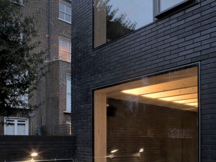 A Fascinating Home with Black Engineering Bricks and Slabs of White Marble in London by Liddicoat & Goldhill (19)