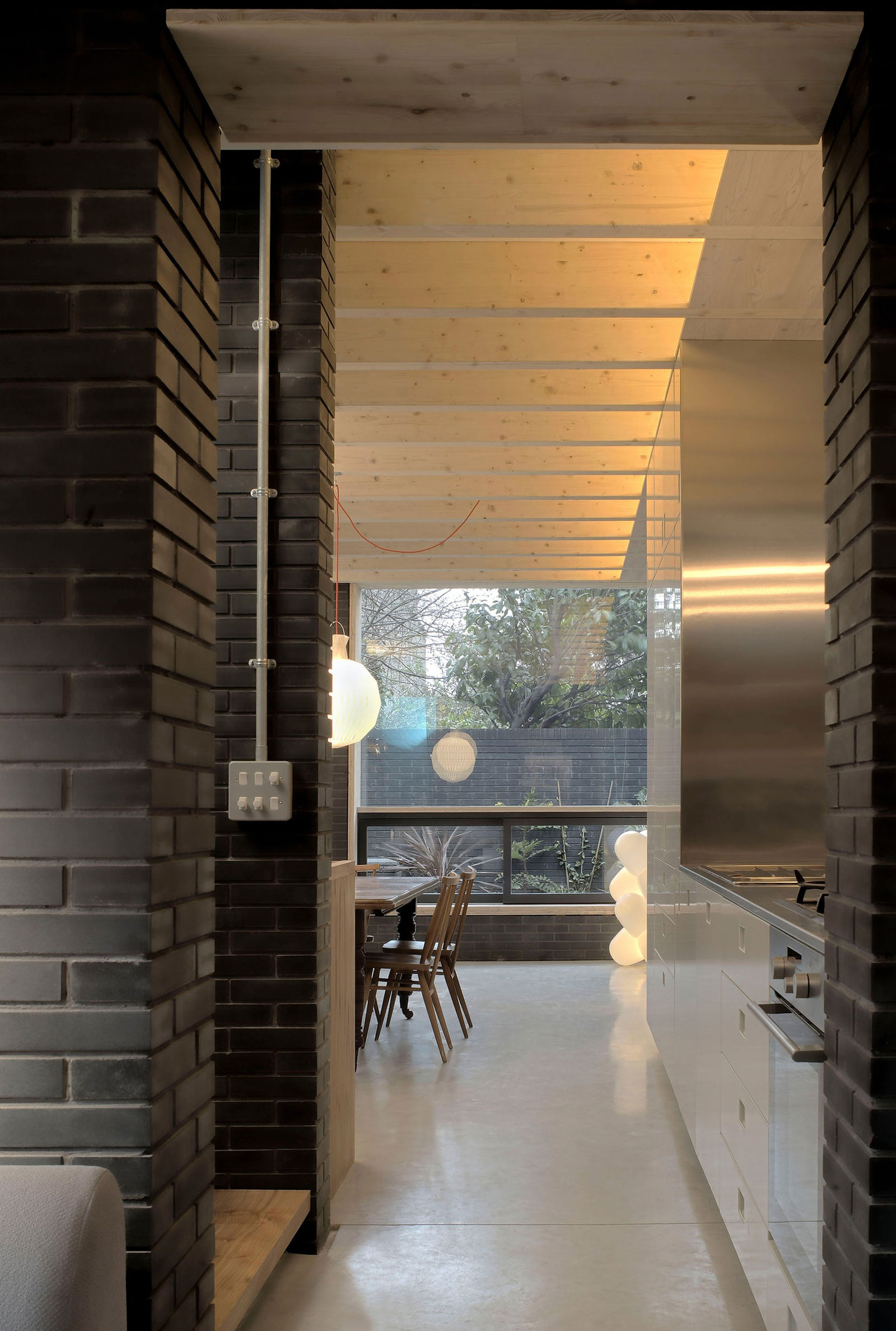 A Fascinating Home with Black Engineering Bricks and Slabs of White Marble in London by Liddicoat & Goldhill (7)