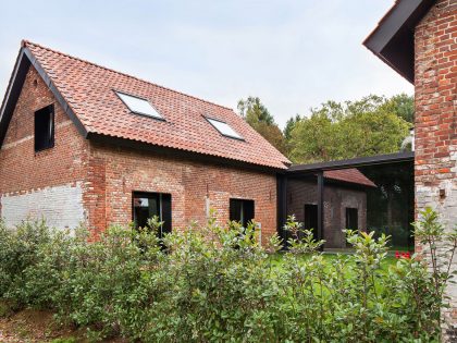 A Former Hunting Lodge Transformed into a Sleek Modern Family Home in Heverlee, Belgium by DMOA Architecten (1)