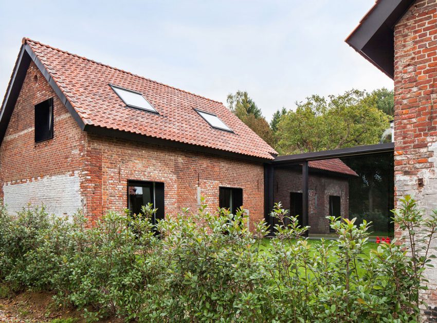 A Former Hunting Lodge Transformed into a Sleek Modern Family Home in Heverlee, Belgium by DMOA Architecten (1)