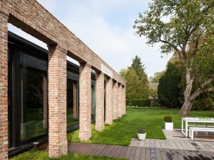 A Former Hunting Lodge Transformed into a Sleek Modern Family Home in Heverlee, Belgium by DMOA Architecten (11)