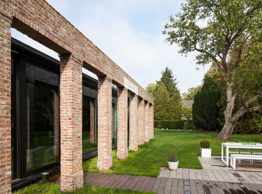 A Former Hunting Lodge Transformed into a Sleek Modern Family Home in Heverlee, Belgium by DMOA Architecten (11)