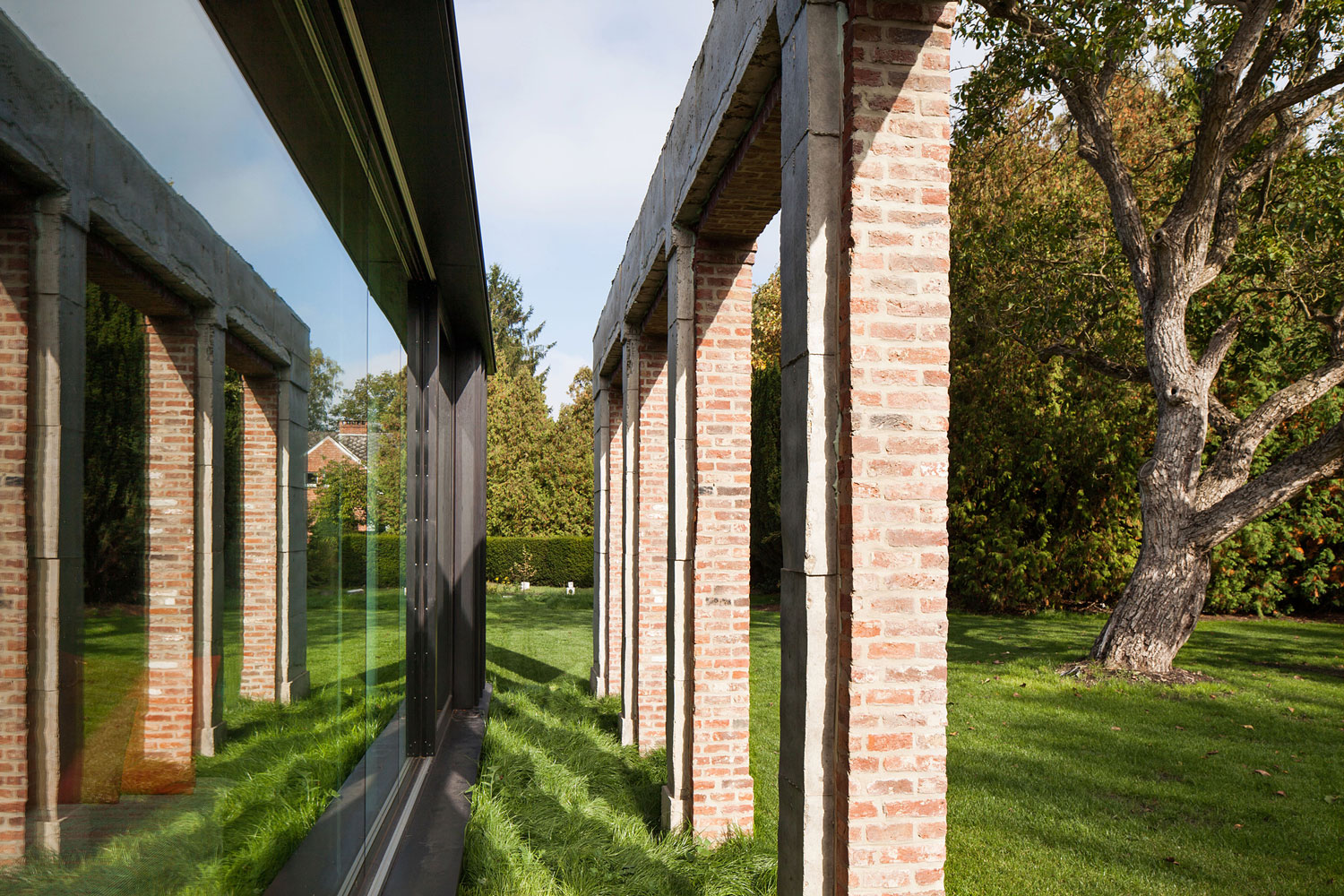 A Former Hunting Lodge Transformed into a Sleek Modern Family Home in Heverlee, Belgium by DMOA Architecten (12)