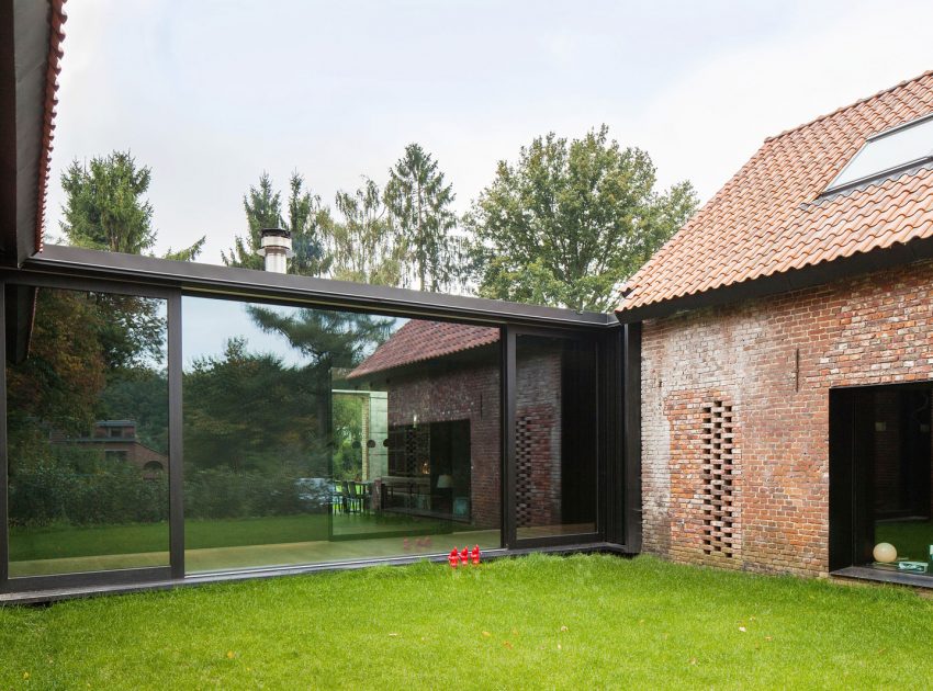 A Former Hunting Lodge Transformed into a Sleek Modern Family Home in Heverlee, Belgium by DMOA Architecten (2)