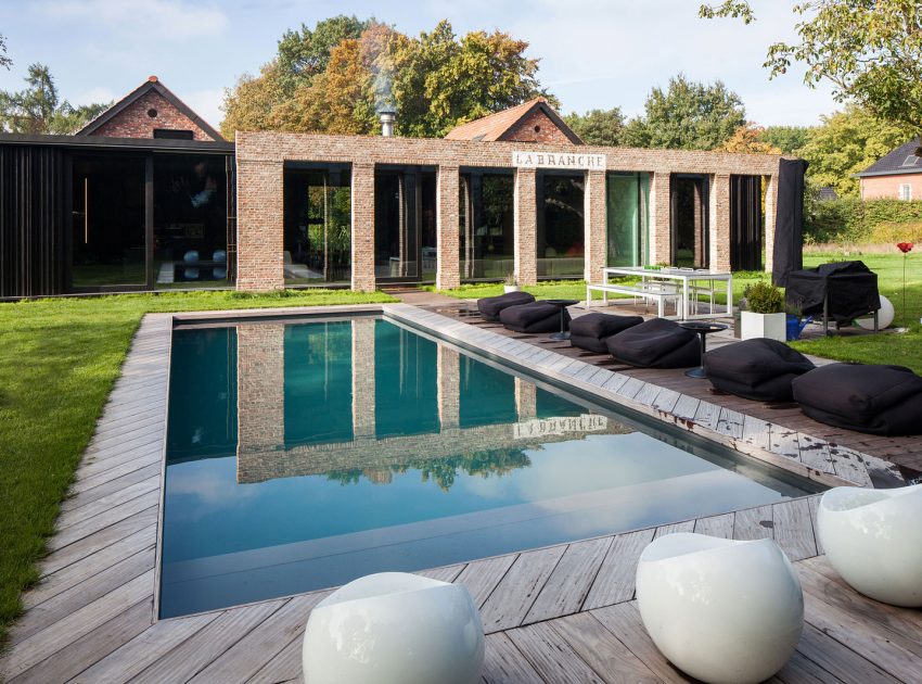 A Former Hunting Lodge Transformed into a Sleek Modern Family Home in Heverlee, Belgium by DMOA Architecten (3)