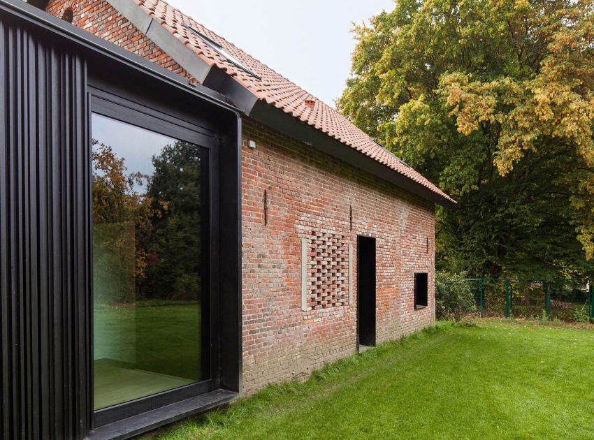 A Former Hunting Lodge Transformed into a Sleek Modern Family Home in Heverlee, Belgium by DMOA Architecten (6)
