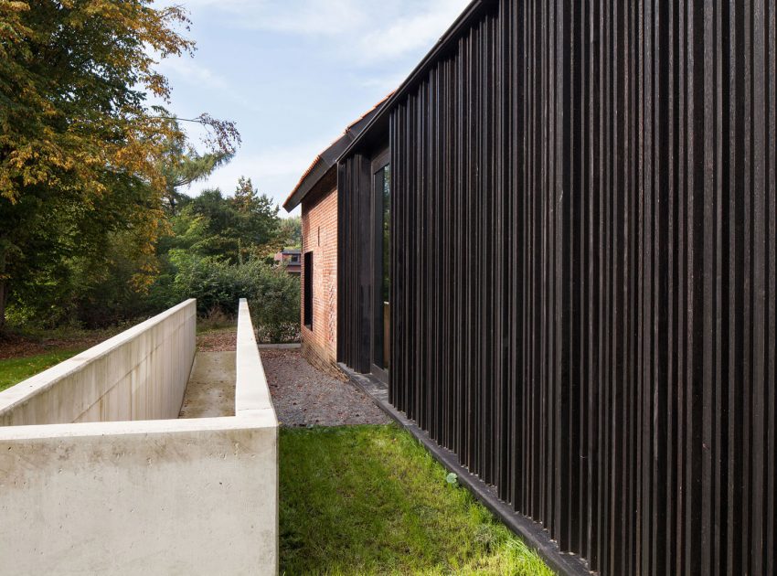 A Former Hunting Lodge Transformed into a Sleek Modern Family Home in Heverlee, Belgium by DMOA Architecten (8)