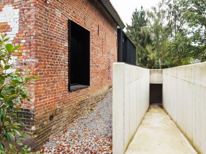 A Former Hunting Lodge Transformed into a Sleek Modern Family Home in Heverlee, Belgium by DMOA Architecten (9)