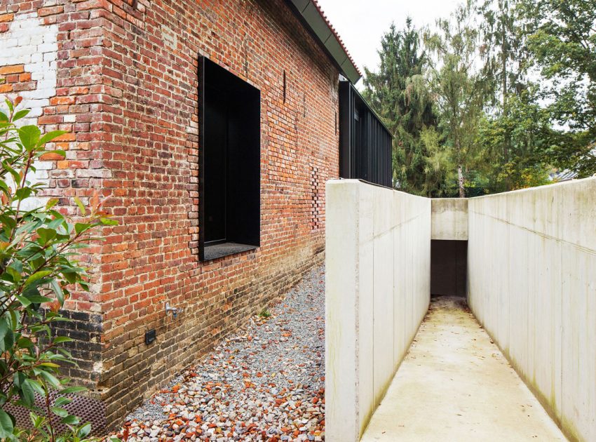 A Former Hunting Lodge Transformed into a Sleek Modern Family Home in Heverlee, Belgium by DMOA Architecten (9)