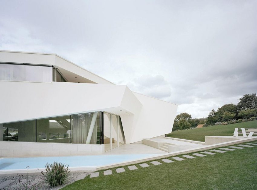 A Futuristic Modern White Home with Sleek and Stunning Views in Vienna by Project A01 Architects (8)