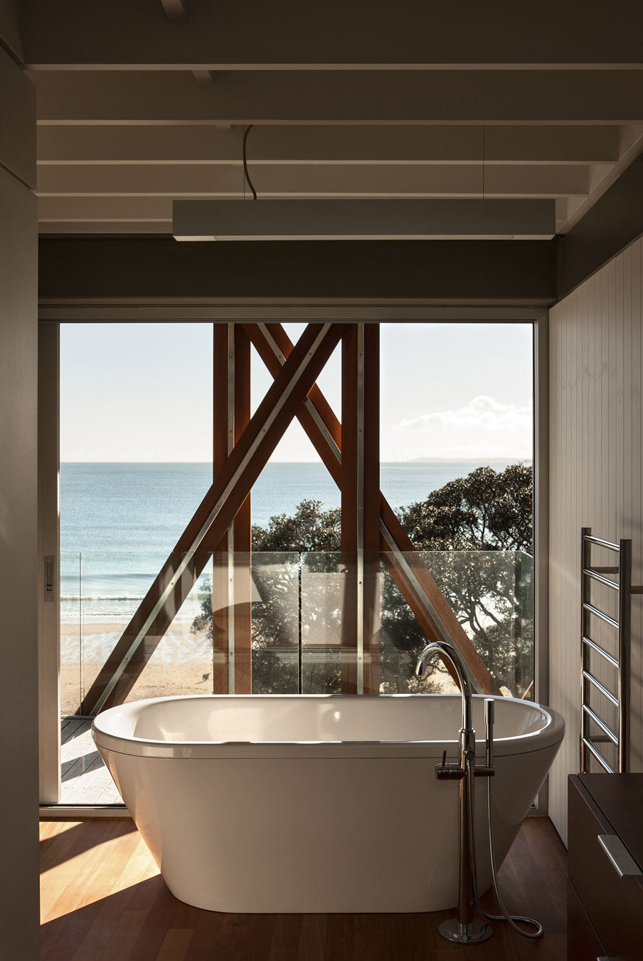A Geometric Modern Beachfront Home Composed of Three Separate Structures in New Zealand by Athfield Architects (26)