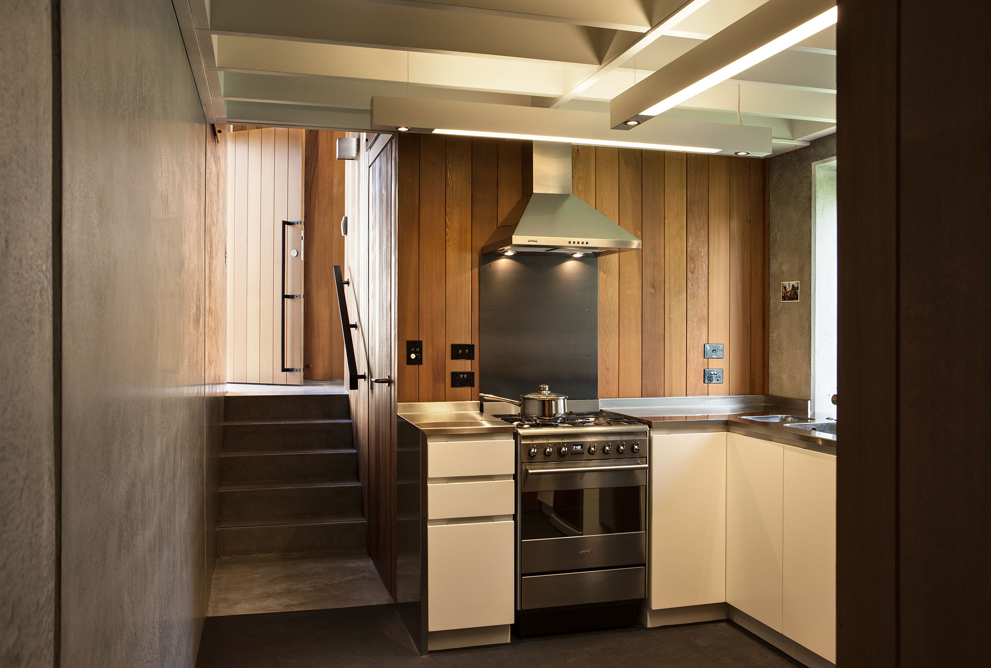 A Geometric Modern Beachfront Home Composed of Three Separate Structures in New Zealand by Athfield Architects (28)