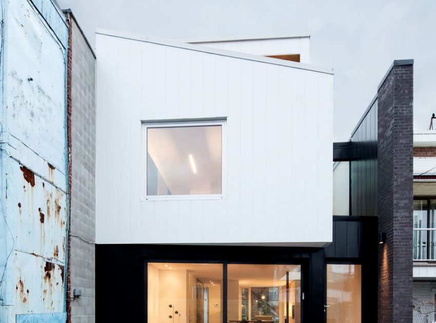 A Home with a Brick Front and a Monochrome Back for Family of Four in Montreal by NatureHumaine (1)