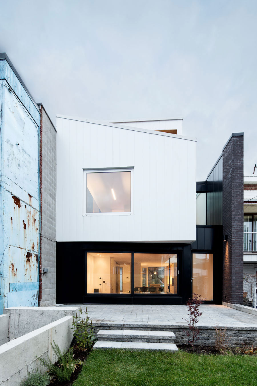 A Home with a Brick Front and a Monochrome Back for Family of Four in Montreal by NatureHumaine (1)