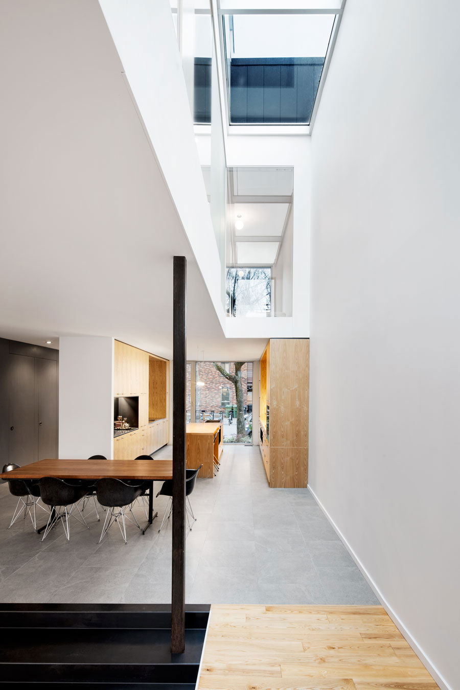 A Home with a Brick Front and a Monochrome Back for Family of Four in Montreal by NatureHumaine (12)