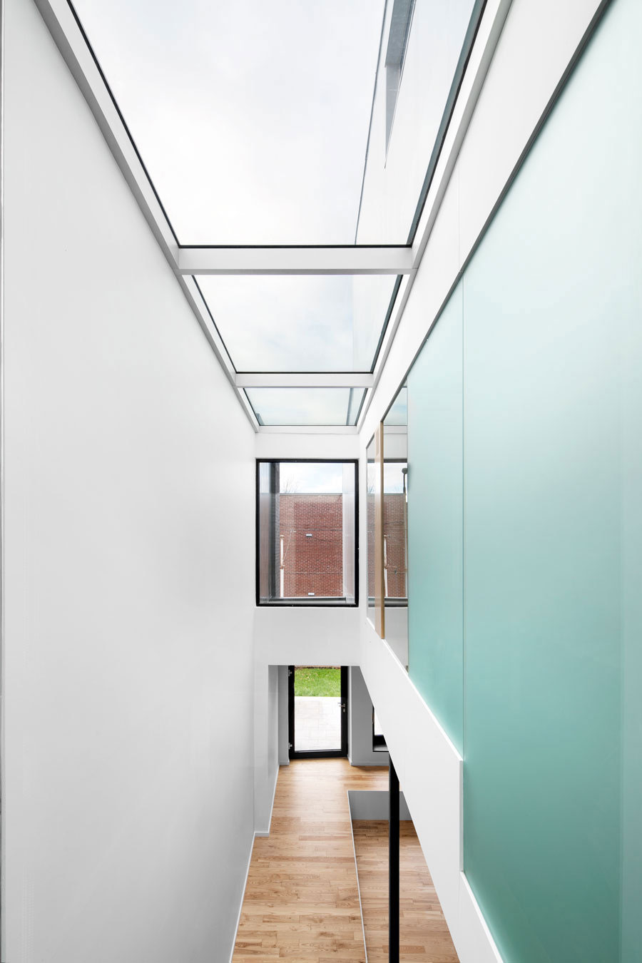 A Home with a Brick Front and a Monochrome Back for Family of Four in Montreal by NatureHumaine (16)