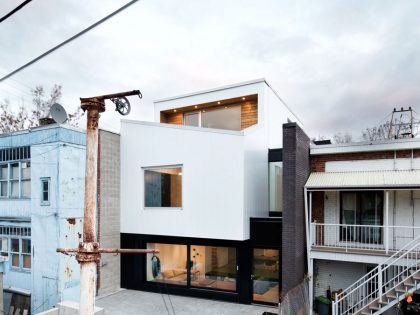 A Home with a Brick Front and a Monochrome Back for Family of Four in Montreal by NatureHumaine (2)