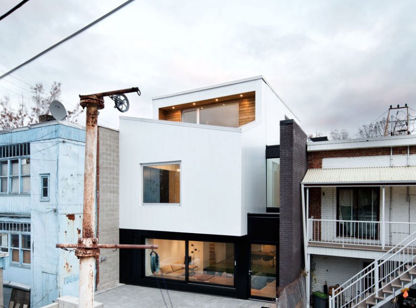 A Home with a Brick Front and a Monochrome Back for Family of Four in Montreal by NatureHumaine (2)