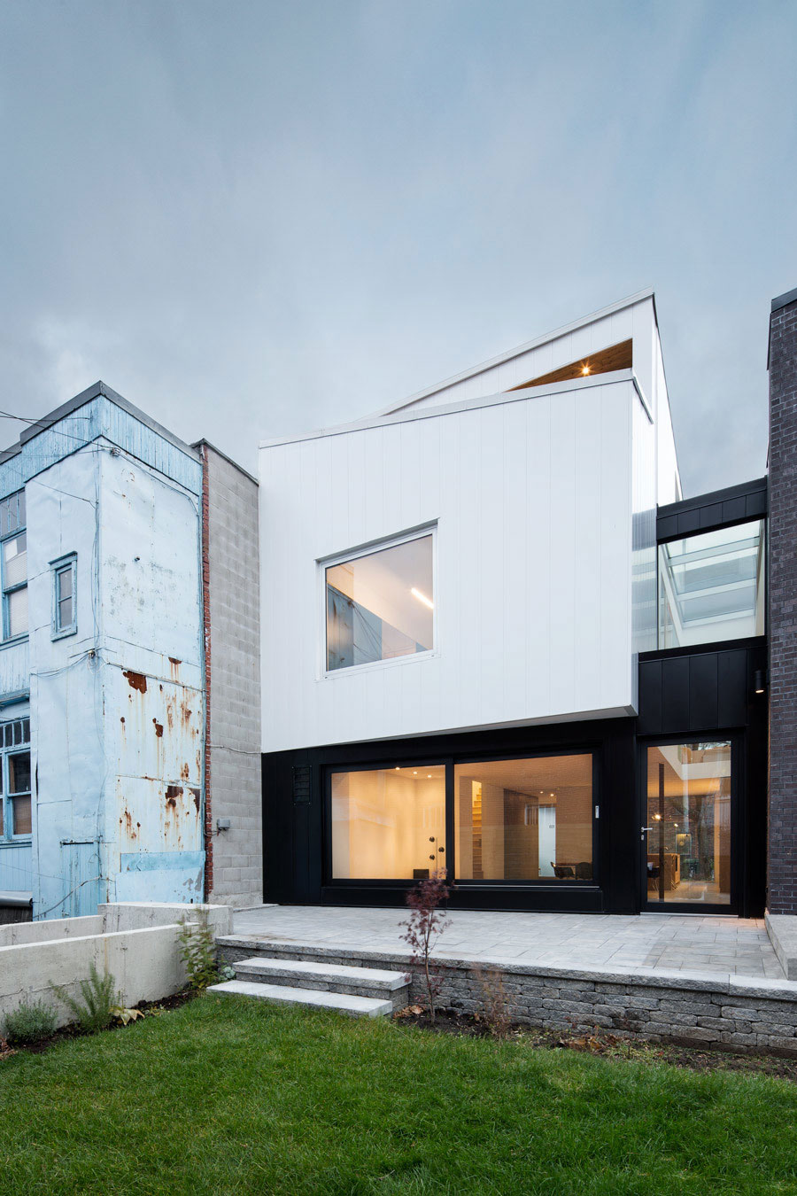 A Home with a Brick Front and a Monochrome Back for Family of Four in Montreal by NatureHumaine (3)