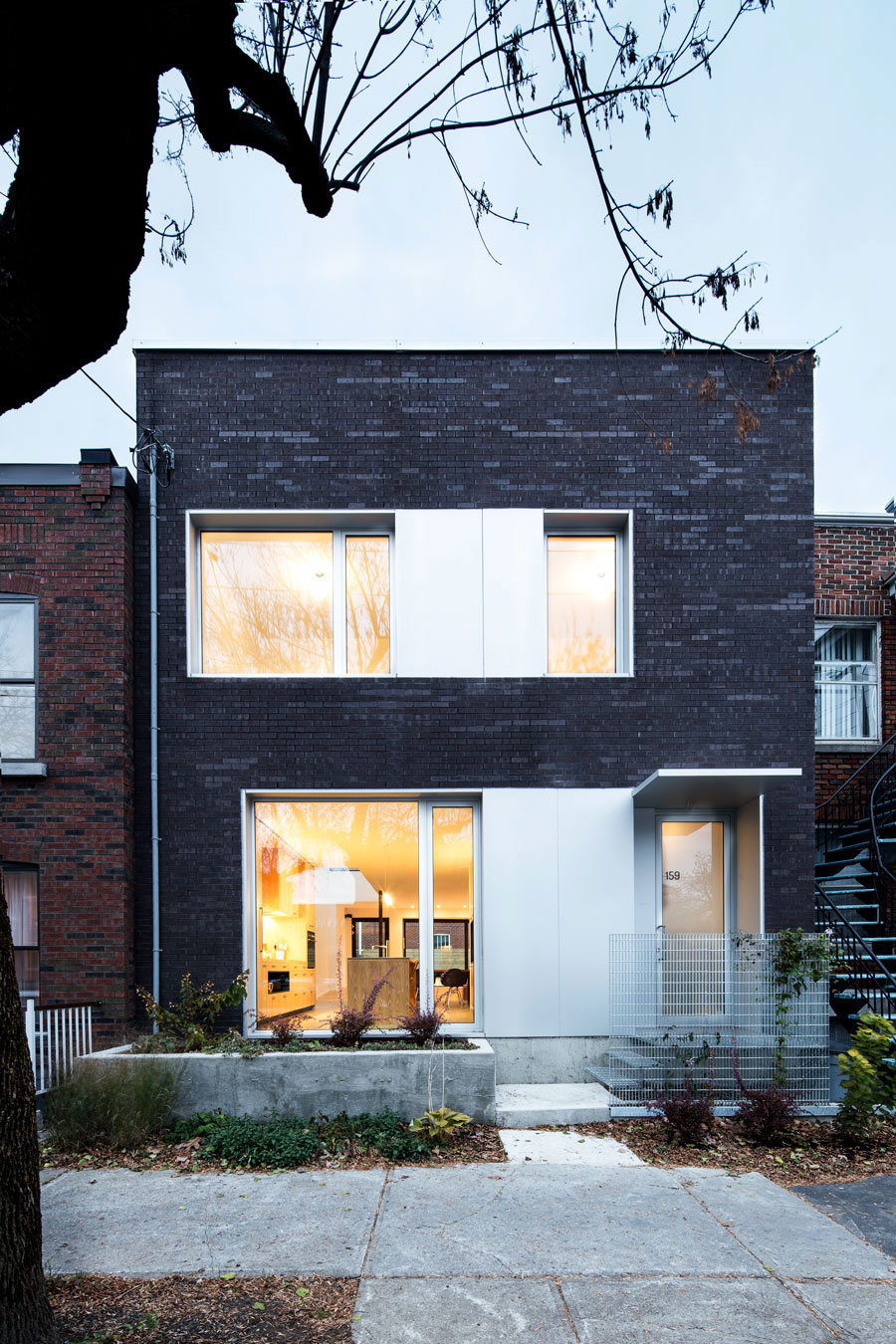 A Home with a Brick Front and a Monochrome Back for Family of Four in Montreal by NatureHumaine (5)