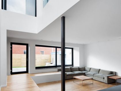 A Home with a Brick Front and a Monochrome Back for Family of Four in Montreal by NatureHumaine (7)