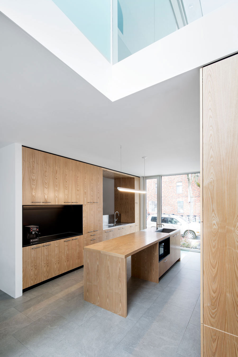 A Home with a Brick Front and a Monochrome Back for Family of Four in Montreal by NatureHumaine (8)