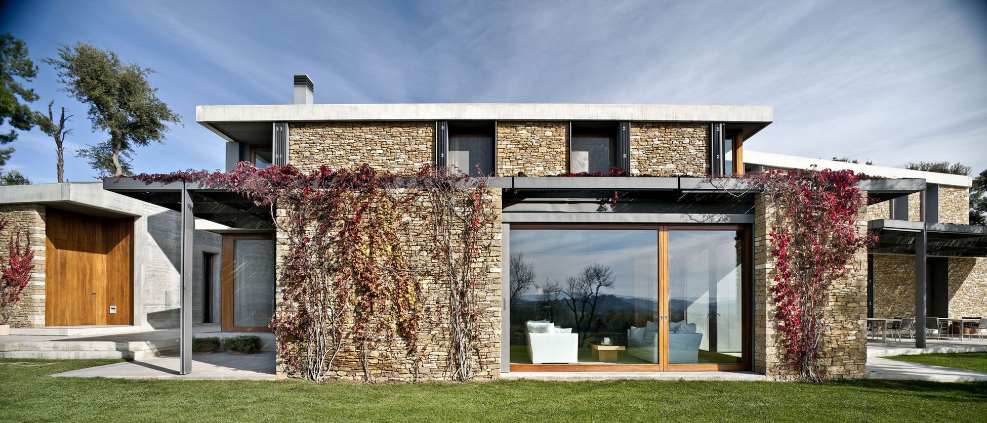 A Modern House with Stone on the Outside and Exposed Concrete on the Inside in El Ampurdán by b720 Fermín Vázquez Arquitectos (1)
