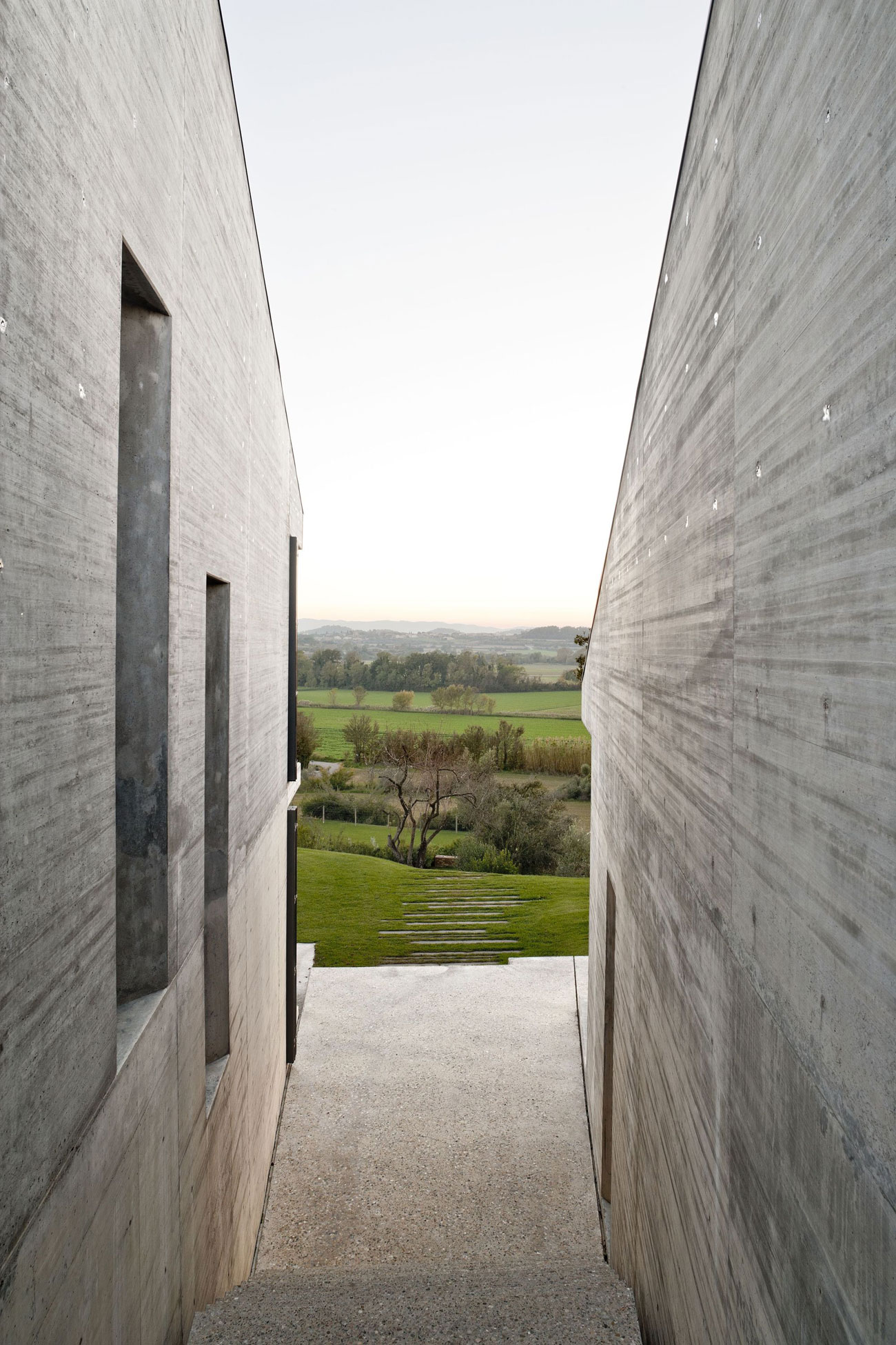 A Modern House with Stone on the Outside and Exposed Concrete on the Inside in El Ampurdán by b720 Fermín Vázquez Arquitectos (10)