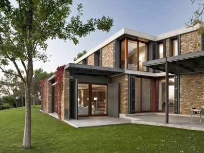 A Modern House with Stone on the Outside and Exposed Concrete on the Inside in El Ampurdán by b720 Fermín Vázquez Arquitectos (11)