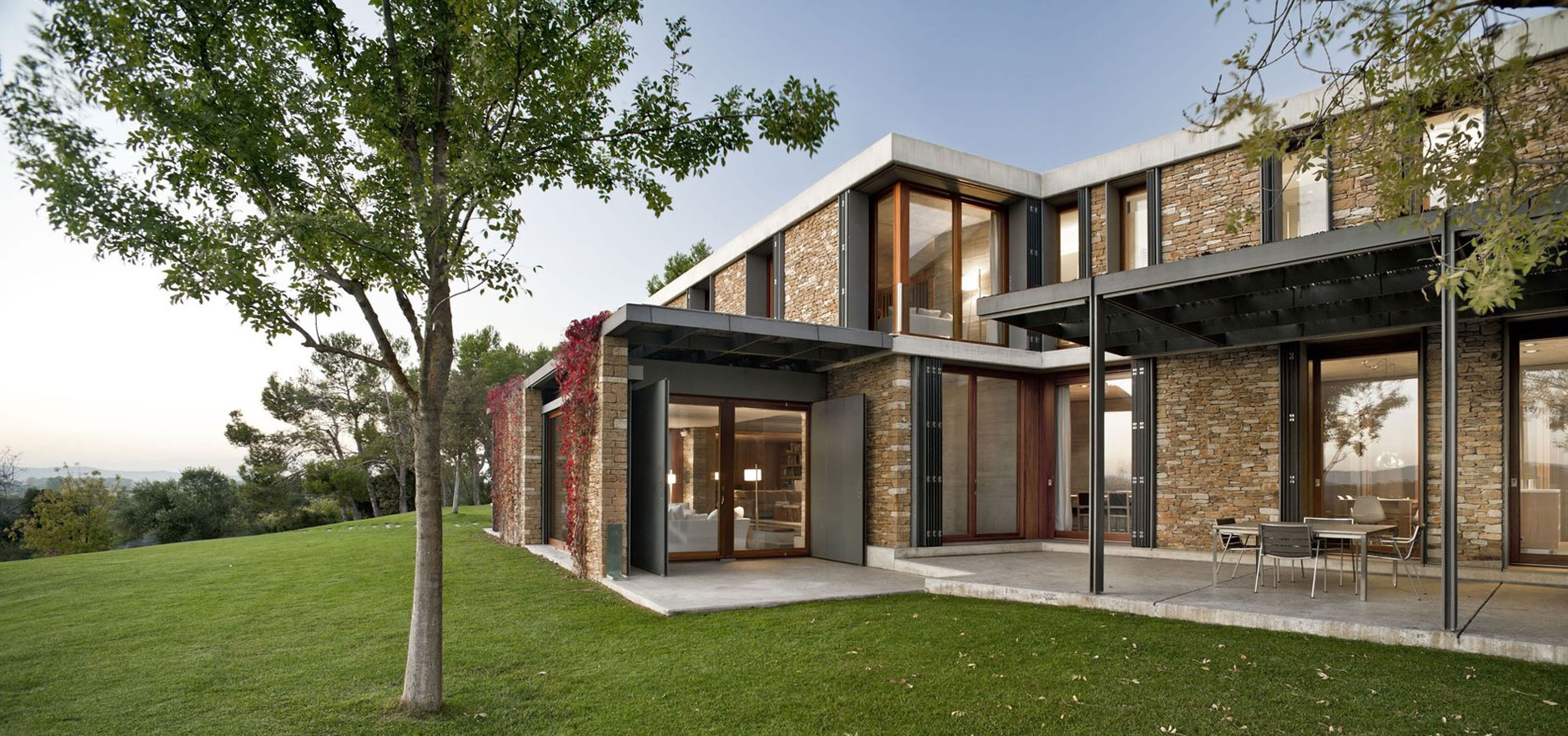 A Modern House with Stone on the Outside and Exposed Concrete on the Inside in El Ampurdán by b720 Fermín Vázquez Arquitectos (11)