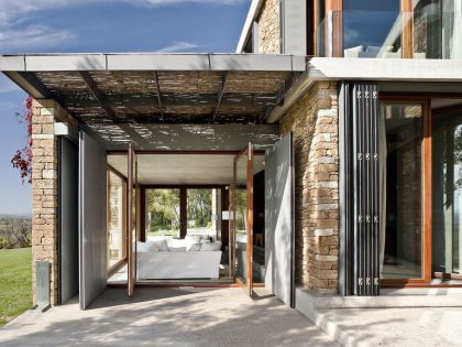 A Modern House with Stone on the Outside and Exposed Concrete on the Inside in El Ampurdán by b720 Fermín Vázquez Arquitectos (12)