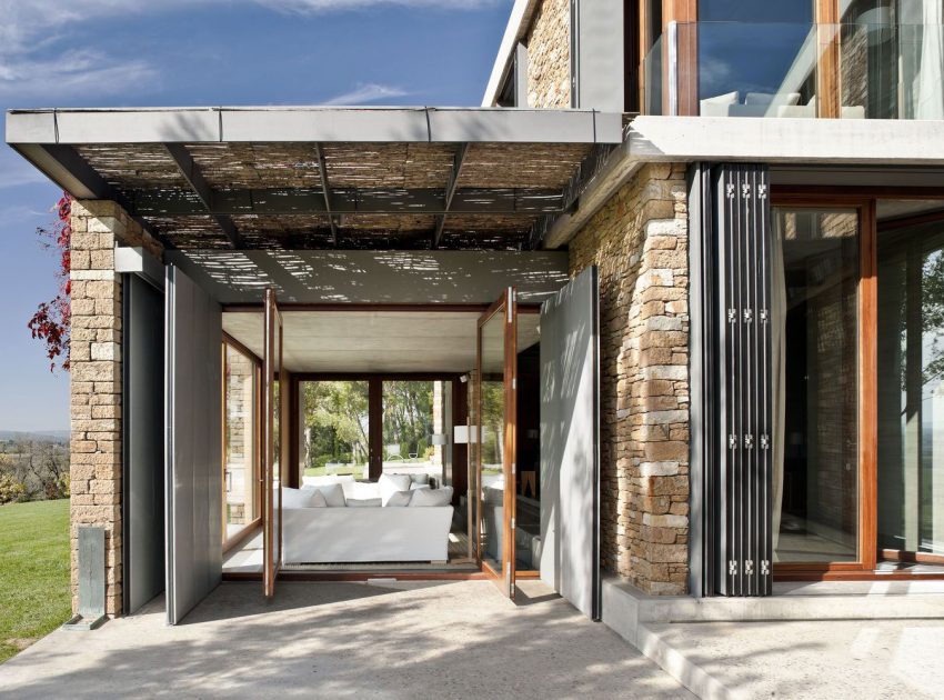 A Modern House with Stone on the Outside and Exposed Concrete on the Inside in El Ampurdán by b720 Fermín Vázquez Arquitectos (12)