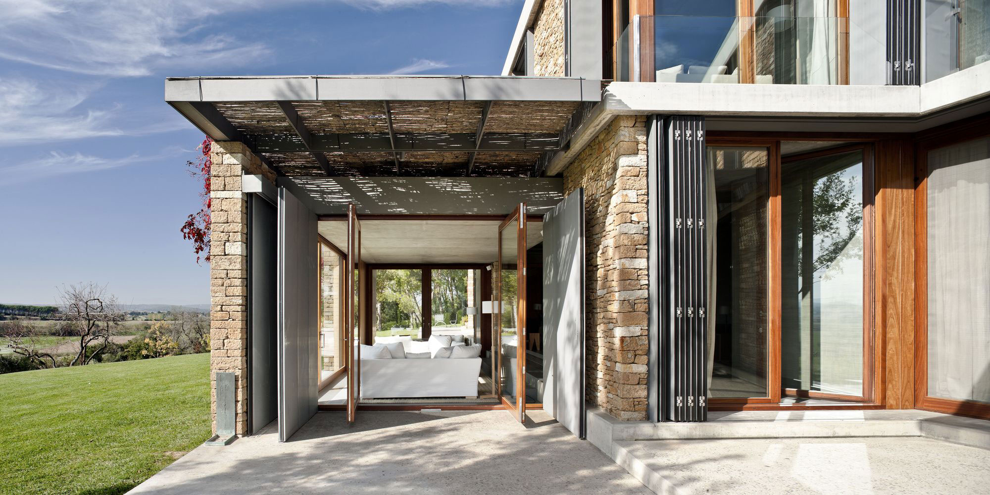 A Modern House with Stone on the Outside and Exposed Concrete on the Inside in El Ampurdán by b720 Fermín Vázquez Arquitectos (12)