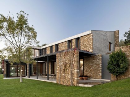 A Modern House with Stone on the Outside and Exposed Concrete on the Inside in El Ampurdán by b720 Fermín Vázquez Arquitectos (13)