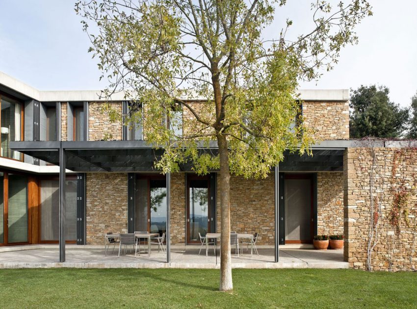 A Modern House with Stone on the Outside and Exposed Concrete on the Inside in El Ampurdán by b720 Fermín Vázquez Arquitectos (14)